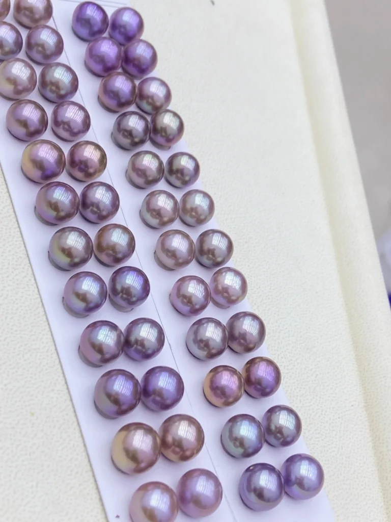 Freshwater pearls in natural purple and metallic tones sourced from Zhuji, China