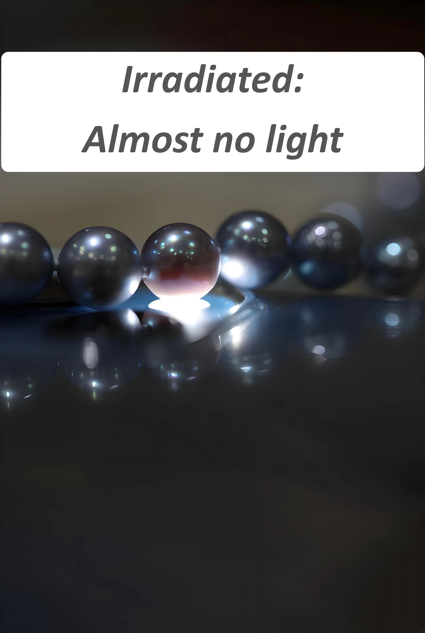 Irradiated grey pearl under flashlight appearing opaque