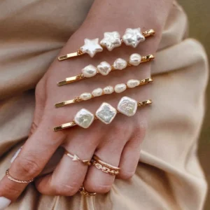 Four handmade pearl hairpins featuring genuine freshwater pearls in star, square, keshi, and natural stone shapes.