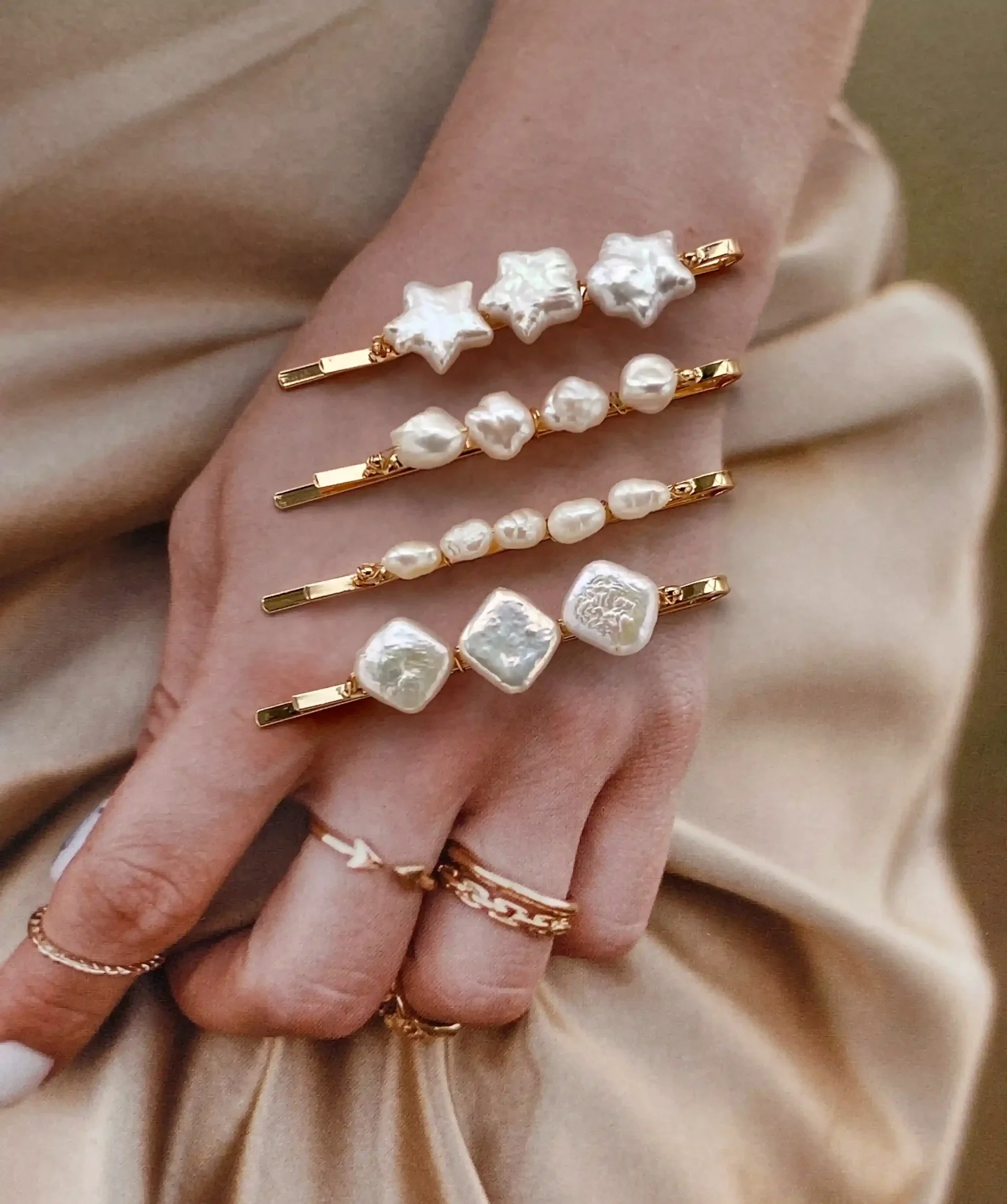 Four handmade pearl hairpins featuring genuine freshwater pearls in star, square, keshi, and natural stone shapes.